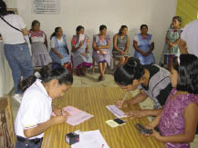 Women filling out microcredit forms and getting information on microinsurance_Mexico.tif